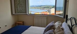 Postel nebo postele na pokoji v ubytování El Azulin de Candás con Wifi Incluido