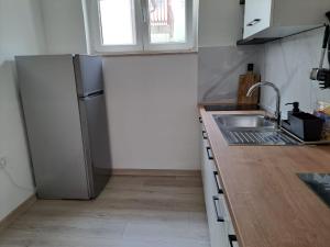 Kuchyň nebo kuchyňský kout v ubytování Apartman Alberta