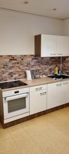 Kuchyň nebo kuchyňský kout v ubytování Ferienwohnung Vido - Nordhalben + 22 fotografií
