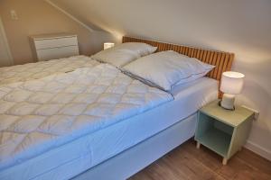 Postel nebo postele na pokoji v ubytování Familienglück Lautenthal