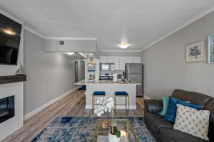 a living room with a couch and a kitchen at Wake up to the ocean breeze - Enjoy amazing views in Tampa