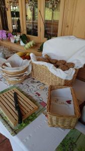 a table with baskets of food on top of it at Gasthof Schönblick Rußbach in Gseng