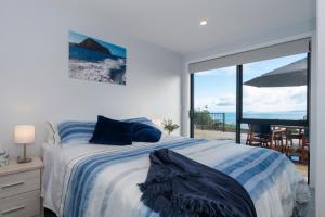 Vuode tai vuoteita majoituspaikassa Luxury Lookout - Cable Bay Holiday Home