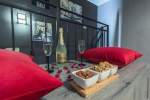 a table with a bottle of champagne and wine glasses at Capitans House in Šibenik