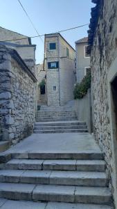 a group of stone stairs in an alley at Capitain*s House in Šibenik