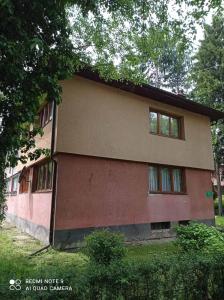 a house with a lot of windows on it at Apartman Asja in Visoko