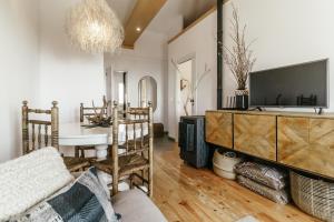 TV a/nebo společenská místnost v ubytování Casa do Baloiço