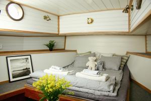 a bed in a room with a teddy bear on it at Saimaa Experience in Savonlinna