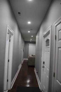 a hallway with a room with a bed and a door at Upscale apartment Westside of Chicago in Chicago