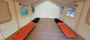 an inside of a tent with two benches in it at Private place for rest in the forest Tent 1 Forrest Cump in Lenoir