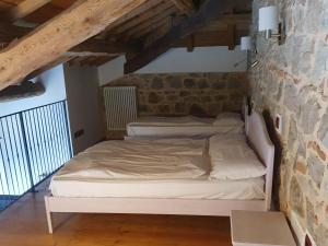 Postel nebo postele na pokoji v ubytování Residenza Tito Livio Teolo