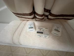 a close up of a bathroom with towels on a bed at Fossil Butte Motel in Kemmerer