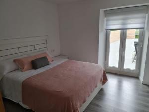 Łóżko lub łóżka w pokoju w obiekcie Casa Cainzal