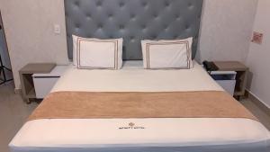 Voodi või voodid majutusasutuse Infinity Hotel toas