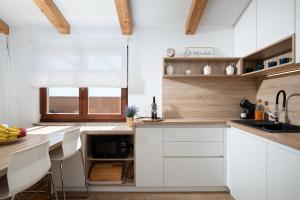 A kitchen or kitchenette at Cesare Apartment, with Swimming pool and Sea view