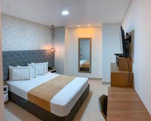 Voodi või voodid majutusasutuse Infinity Hotel toas