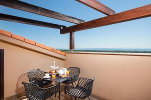 A balcony or terrace at Cesare Apartment, with Swimming pool and Sea view