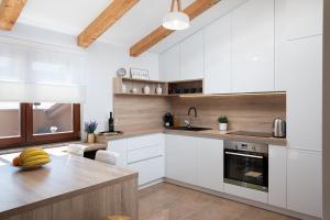 A kitchen or kitchenette at Cesare Apartment, with Swimming pool and Sea view