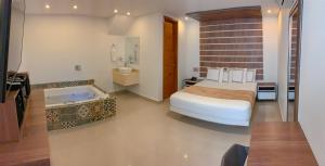 Voodi või voodid majutusasutuse Infinity Hotel toas
