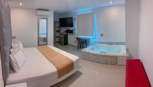 Voodi või voodid majutusasutuse Infinity Hotel toas