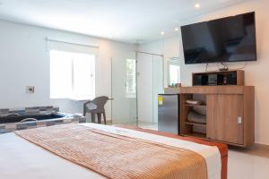 Postel nebo postele na pokoji v ubytování Infinity Hotel