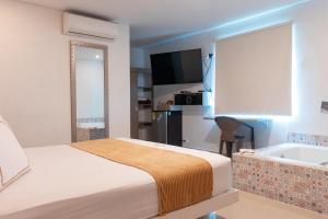 Voodi või voodid majutusasutuse Infinity Hotel toas
