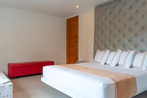 Voodi või voodid majutusasutuse Infinity Hotel toas