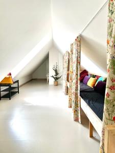 a room with a bunk bed in a attic at A true nature pearl in idyllic surroundings but close to the city in Holbæk