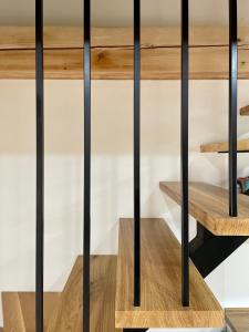 a room with black railings and wood shelves at Villa Ondina in Brtonigla