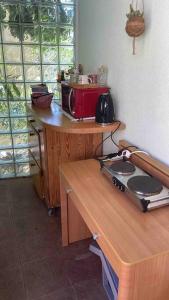 a kitchen with a microwave on a wooden table at Center of town rooms!No.1 in Vis