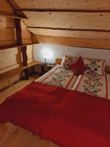 a bedroom with a large bed in a attic at Domek pod Holicą 3 Bieszczady in Ustianowa