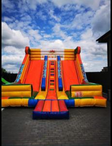 a large inflatable playground with a colorful slide at Gigios Sport&Relax in Băileşti