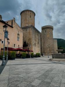 a large castle with two towers on a street at Summer House in Fondi