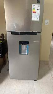 a stainless steel refrigerator in a kitchen at Casa Iberá in Mercedes