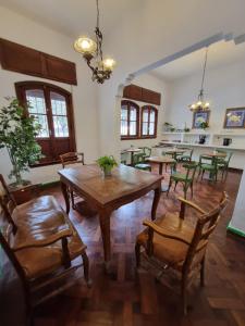 a dining room with a wooden table and chairs at Terraza de la Usina in Salta