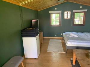 Postel nebo postele na pokoji v ubytování The Green Cabin