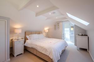 En eller flere senge i et værelse på Sandy Lodge Rock