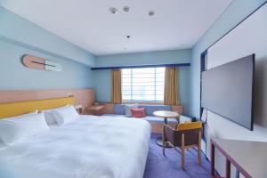 Postel nebo postele na pokoji v ubytování Miyako Hotel Kyoto Hachijo