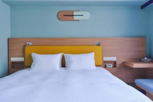 Postel nebo postele na pokoji v ubytování Miyako Hotel Kyoto Hachijo