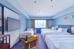 Postel nebo postele na pokoji v ubytování Miyako Hotel Kyoto Hachijo
