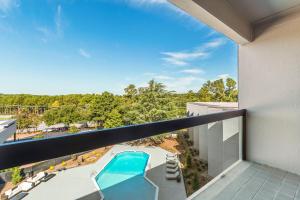 a balcony with a view of a swimming pool at Sheraton Chapel Hill in Chapel Hill