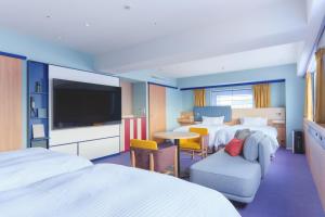 Postel nebo postele na pokoji v ubytování Miyako Hotel Kyoto Hachijo