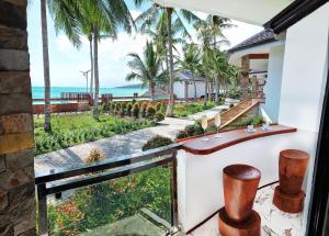 a view of the ocean from the balcony of a resort at Philippines Paradise Beachfront Hotel in San Francisco