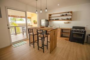 a kitchen with a island with a stove top oven at Casa Arena 2 in Big Creek