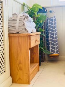 a pile of towels sitting on top of a table at Hare view Cottage - Northumberland in East Thirston