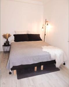 Voodi või voodid majutusasutuse Le Cocon de Poissy toas