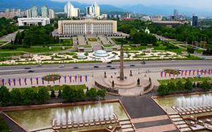 a view of a park with a fountain and a city at 429. Отличный вариант для туриста и командированного in Almaty