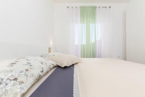 Postel nebo postele na pokoji v ubytování Kuća Lana