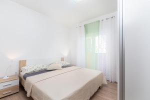 Postel nebo postele na pokoji v ubytování Kuća Lana