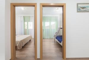 Postel nebo postele na pokoji v ubytování Kuća Lana